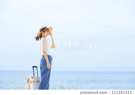 Young woman traveling 111391413