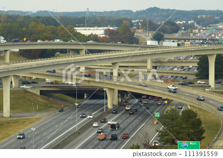 American freeway intersection with fast driving cars and trucks. View from above of USA transportation infrastructure 111391559