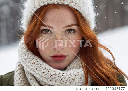 AI-generated content. Winter portrait of a young red-haired girl in a knitted hat and scarf covered with snow. Face with freckles close-up. Snowy winter beauty concept. 111392177