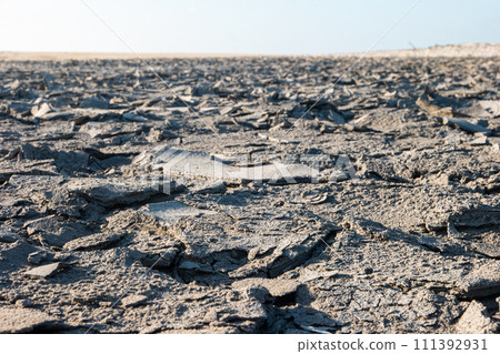 Cracked sandy mud ground texture 111392931