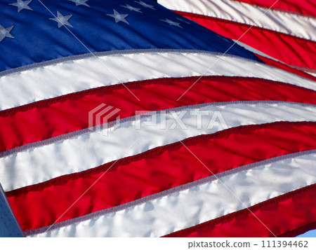 US Flag waves in the wind 111394462