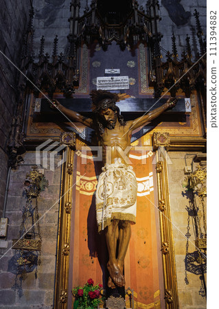 Jesus on the cross statue inside christian church Basilica of the Immaculate Conception and Assumption of Our Lady - Basilica de la Purissima Concepcio - in Barcelona, Catalonia Spain. Jesus on the cross statue inside christian church Basilica of the Immaculate Conception and Assumption of Our Lady - Basilica de la Purissima Concepcio - in Barcelona, Catalonia Spain. 111394882