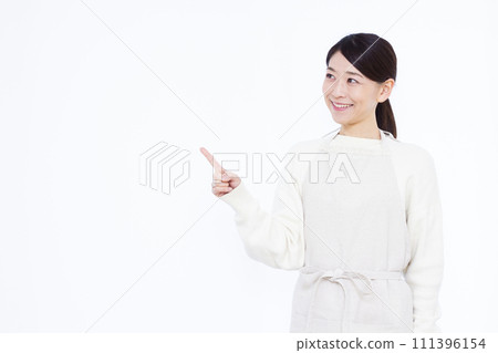 Housewife in her 40s pointing 111396154