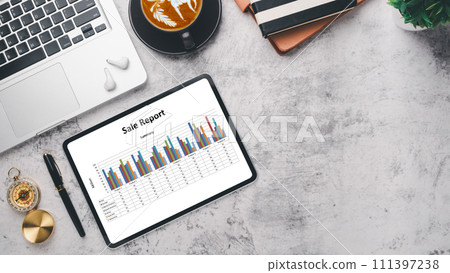 Modern office desk workplace with blank screen digital tablet, pen, laptop computer, notebook and cup of coffee, Top view flat lay with copy space. 111397238