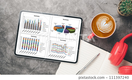 Office desk workplace with blank screen digital tablet, notebook, pen, headphone and cup of coffee, Top view flat lay. 111397240