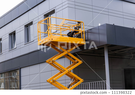 mobile lifting cradle. Construction scissor lift. mobile lifting cradle. Construction scissor lift. 111398322