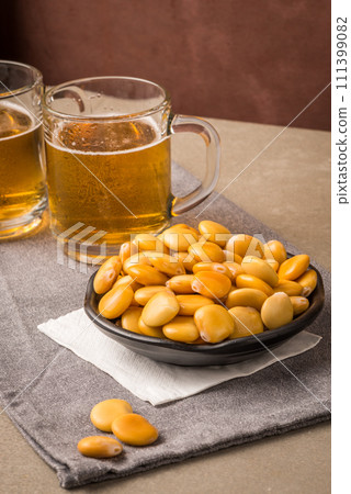 Tasty lupins and glass of beer Tasty lupins and glass of beer 111399082