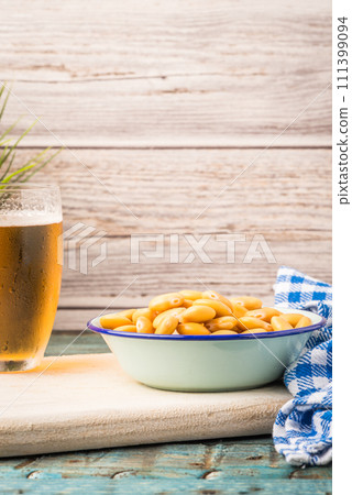 Tasty lupins and glass of beer Tasty lupins and glass of beer 111399094