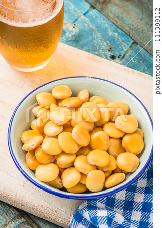 Tasty lupins and glass of beer Tasty lupins and glass of beer 111399112