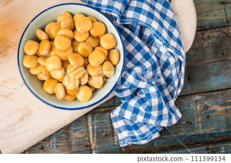 Tasty lupins in metal mug Tasty lupins in metal mug 111399134