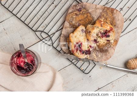 Muffins with red fruits jam fill. Muffins with red fruits jam fill. 111399368