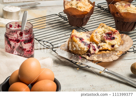 Muffins with red fruits jam fill. Muffins with red fruits jam fill. 111399377