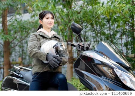  Woman riding a bike 111400699
