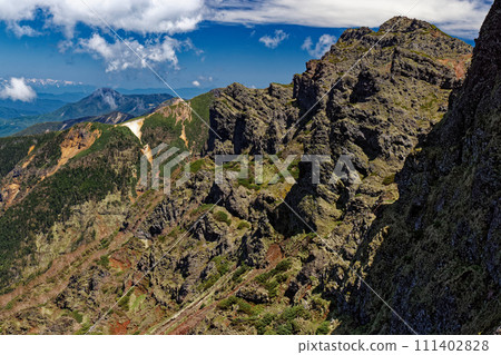 Yatsugatake mountain range, Yokodake rock wall and view towards Tateshina Yatsugatake mountain range, Yokodake rock wall and view towards Tateshina 111402828