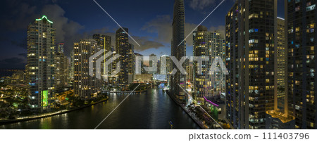 Night urban landscape of downtown district of Miami Brickell in Florida, USA. Skyline with brightly illuminated high skyscraper buildings in modern american megapolis 111403796