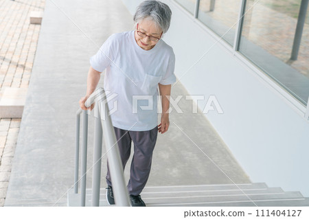 Elderly women going up and down stairs in rehabilitation (locomo, frailty, sarcopenia, osteoporosis) 111404127
