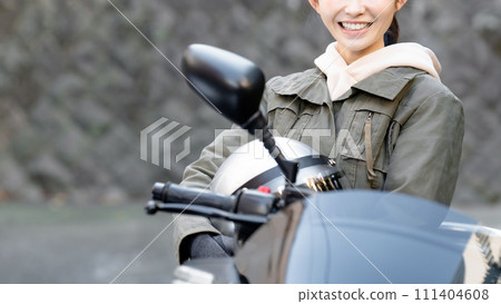  Woman riding a bike 111404608