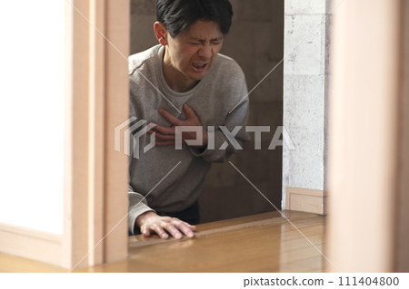 Middle-aged man feels chest pain on the stairs. Chest pain, shortness of breath. 111404800