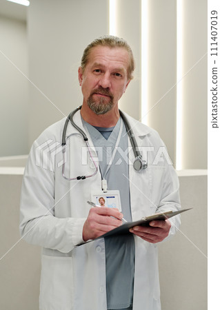 Doctor writing down medical prescription Doctor writing down medical prescription 111407019