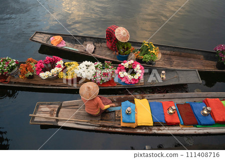 Damnoen Saduak Floating Market or Amphawa. Local people sell fruits, traditional food on boats in canal, Ratchaburi District, Thailand. Famous Asian tourist attraction destination. Festival in Asia. Damnoen Saduak Floating Market or Amphawa. Local people sell fruits, traditional food on boats in canal, Ratchaburi District, Thailand. Famous Asian tourist attraction destination. Festival in Asia. 111408716