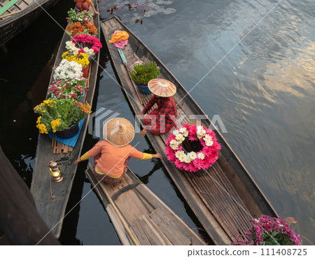 Damnoen Saduak Floating Market or Amphawa. Local people sell fruits, traditional food on boats in canal, Ratchaburi District, Thailand. Famous Asian tourist attraction destination. Festival in Asia. Damnoen Saduak Floating Market or Amphawa. Local people sell fruits, traditional food on boats in canal, Ratchaburi District, Thailand. Famous Asian tourist attraction destination. Festival in Asia. 111408725