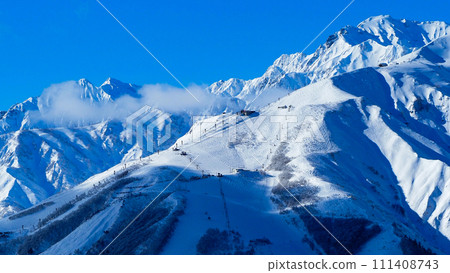 Hakuba Village in winter, snow-capped Northern Alps, Mt. Goryu and Happo-one Ski Resort, 16:9 111408743