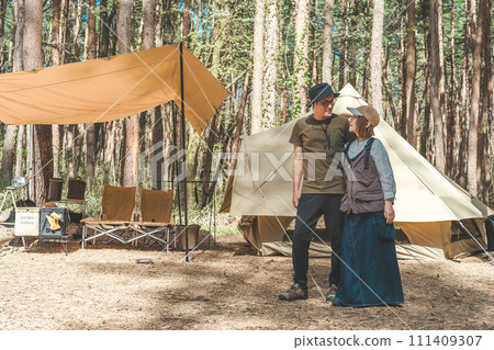 Asian male and female campers camping as a couple (glamping campsite) 111409307