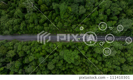 Aerial top view of green electric vehicle car driving over straight forest road, EV car electric vihicle car on forest road with globe green energy and eco power produced from sustainable. 111410301