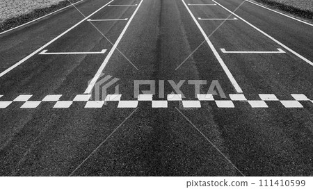 Aerial view abstract asphalt black Start and Finish grid line for race car in circuit texture background, Automobile and automotive background. Aerial view abstract asphalt black Start and Finish grid line for race car in circuit texture background, Automobile and automotive background. 111410599