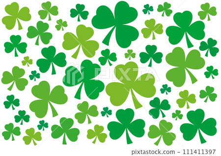 Numerous shamrocks, green three-leaf clover background. Randomly arranged, slightly twisted trefoils with different shades of green. Symbol of Ireland, used by Saint Patrick as Holy Trinity metaphor. 111411397