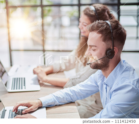 Customer Service Representative With Colleague Working In Office 111412450
