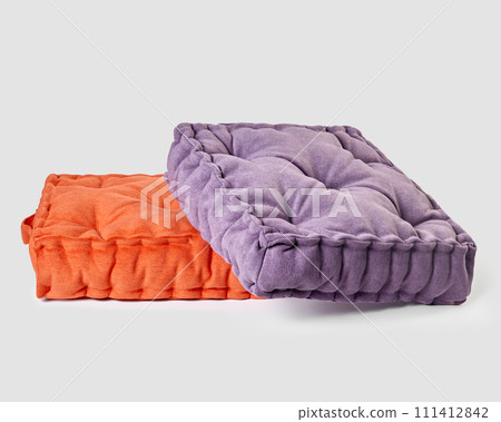 Purple and orange linen seat cushions arranged on white background 111412842