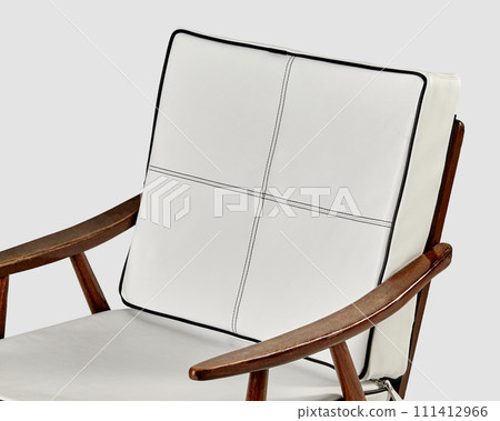 Soft cushions made of white leather on vintage style wooden chair Soft cushions made of white leather on vintage style wooden chair 111412966