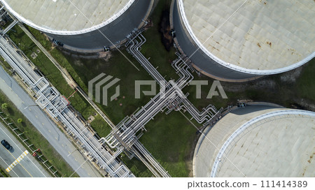 Aerial view liquid chemical tank terminal, Storage of liquid chemical and petrochemical products tank, Oil and gas storage tanks at industrial oil refinery. 111414389