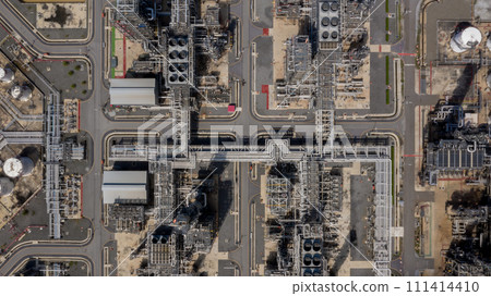 Aerial top view Oil and Gas refinery petrochemical plant industrial with oil and gas storage tank. White oil and gas refinery storage tank. Aerial view oil and gas refinery plant from industrial zone. Aerial top view Oil and Gas refinery petrochemical plant industrial with oil and gas storage tank. White oil and gas refinery storage tank. Aerial view oil and gas refinery plant from industrial zone. 111414410