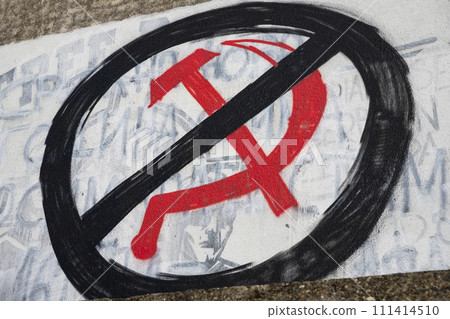 Russian symbol hammer and sickle graffiti crossed out. Sanctions to Russia. Stop the war in Ukraine Russian symbol hammer and sickle graffiti crossed out. Sanctions to Russia. Stop the war in Ukraine 111414510