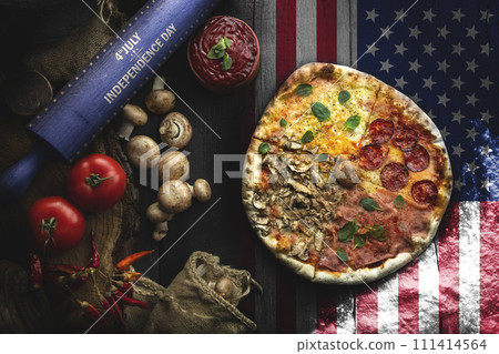 Pizza with different ingredients on the wooden table in the kitchen. American style pizza. Happy 4th of July. Independence day food concept 111414564