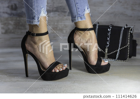 Sexy woman posing in high heels and fashionable purse. Beauty fashion Sexy woman posing in high heels and fashionable purse. Beauty fashion 111414626