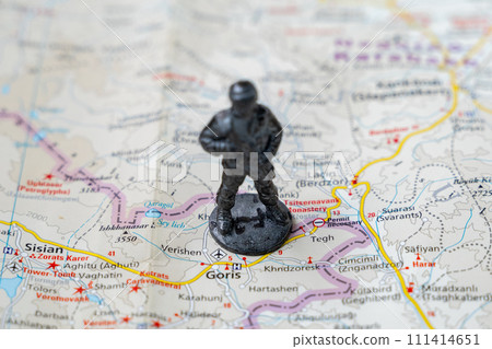 A metal toy soldier stands on the map of the Syunik region of Armenia A metal toy soldier stands on the map of the Syunik region of Armenia 111414651