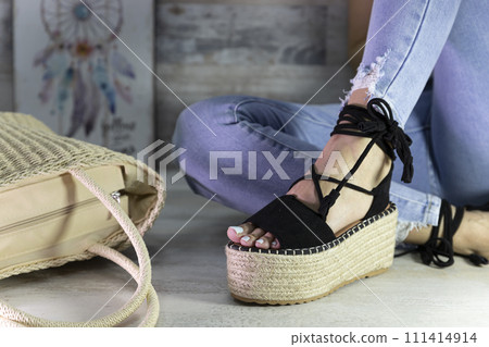 Summer sandals on a womans feet. Beauty fashion styling 111414914
