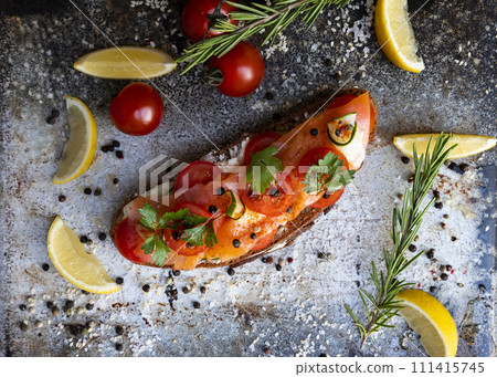 Salted salmon open sandwich with tomatoes, cream cheese, cucumber, parsley and pepper. Healthy seafood Salted salmon open sandwich with tomatoes, cream cheese, cucumber, parsley and pepper. Healthy seafood 111415745