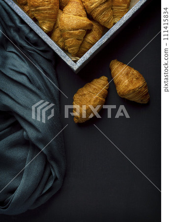 croissants. heap of Freshly baked croissants on dark background.Continental breakfast. 111415834