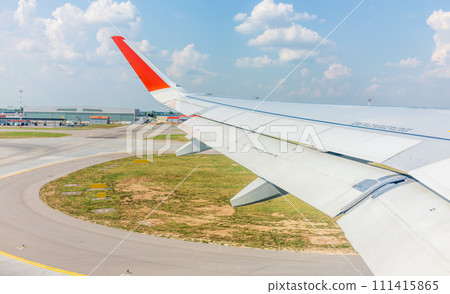 View from the airplane window during takeoff at Sheremetyevo airport at summer View from the airplane window during takeoff at Sheremetyevo airport at summer 111415865