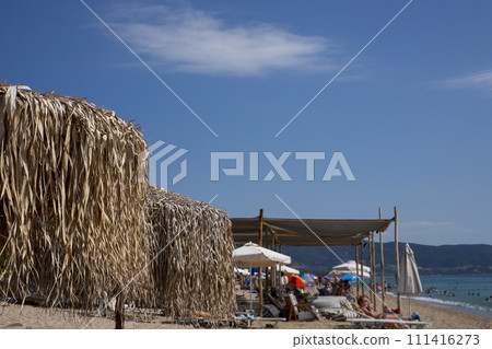 Umbrella made from palm tree leaves at the beach 111416273
