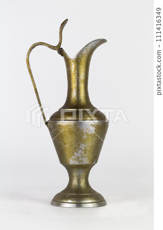 Antique oxidized jug isolated on a white background Antique oxidized jug isolated on a white background 111416349