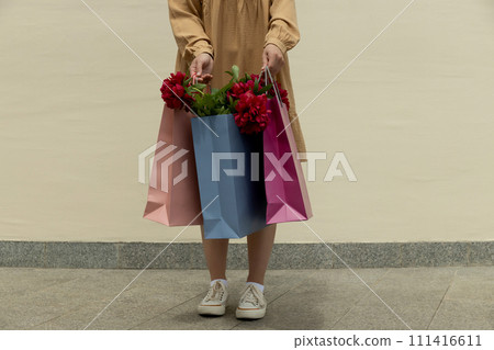Flowers in paper, gift bags, on the street. Flowers in paper, gift bags, on the street. 111416611