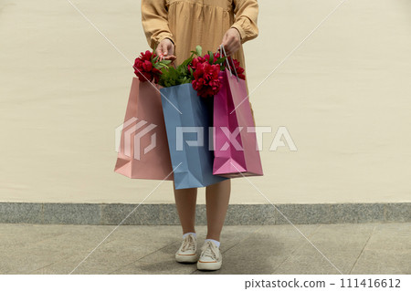 Flowers in paper, gift bags, on the street. Flowers in paper, gift bags, on the street. 111416612