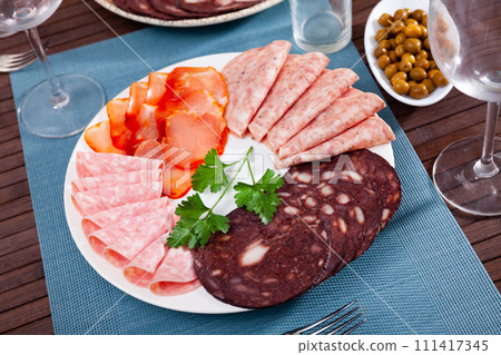 Delicious Spanish antipasto platter with various meat 111417345