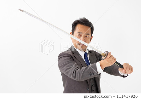 A man in a suit holding a sword A man in a suit holding a sword 111417920