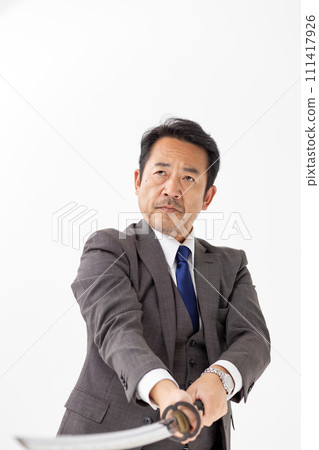 A man in a suit holding a sword 111417926